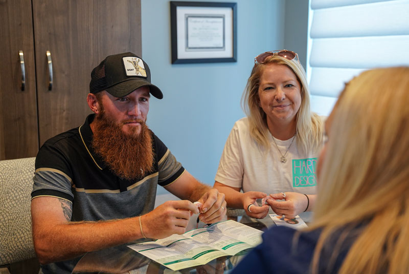 patients discussing dental implants cost